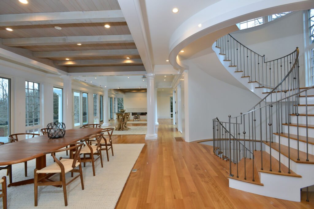 Interior image of Newport Rhode Island waterfront home with dining room and staircase